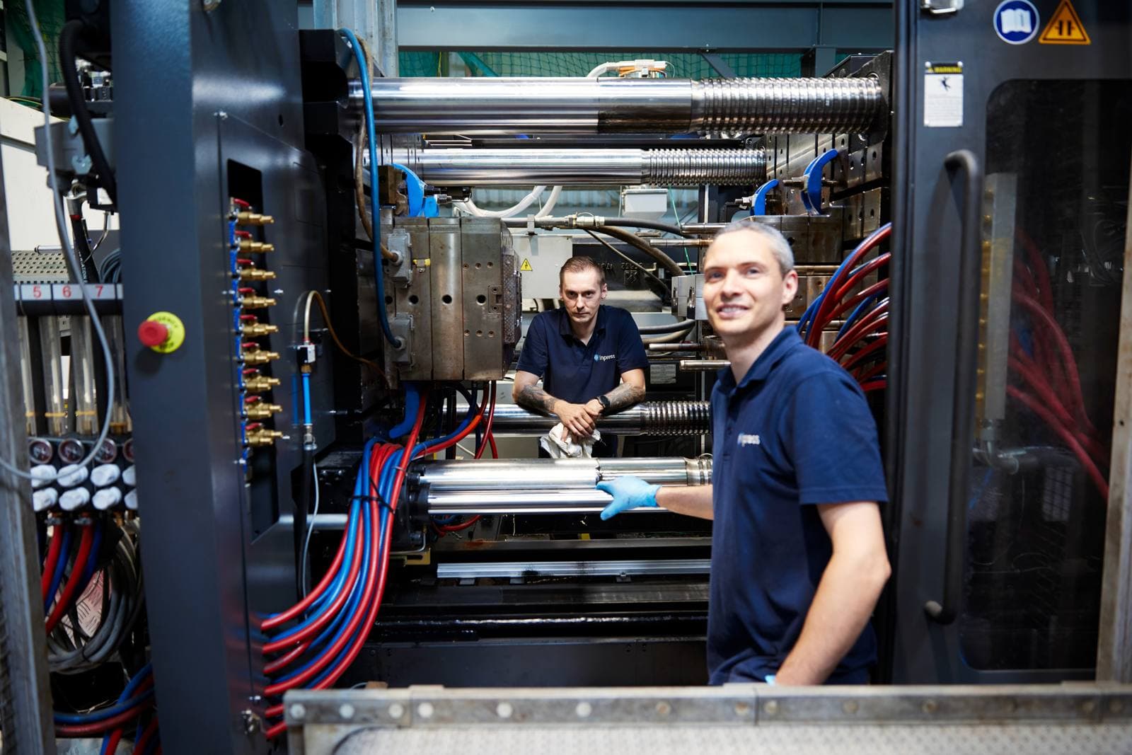Inpress setter smiling inside an injection moulding machine